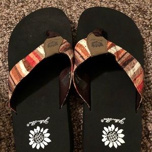 Yellow box flip flops.